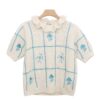 Short-Sleeve Checkered Knit Blouse with Ruffled Collar