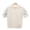 Short-Sleeve Checkered Knit Blouse with Ruffled Collar